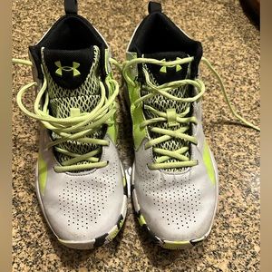 Under Armor high tops tennis shoes.